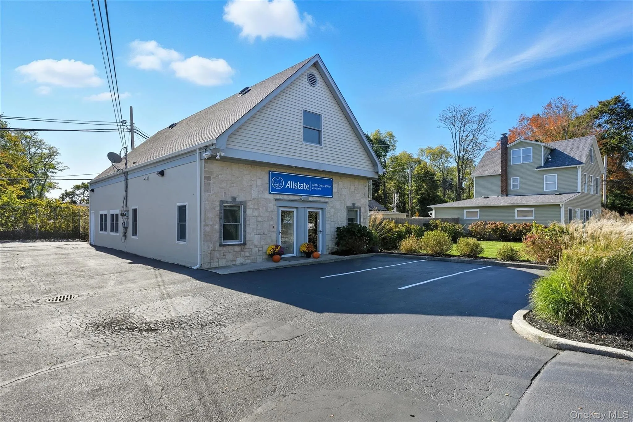 View of property with uncovered parking View of property with uncovered parking