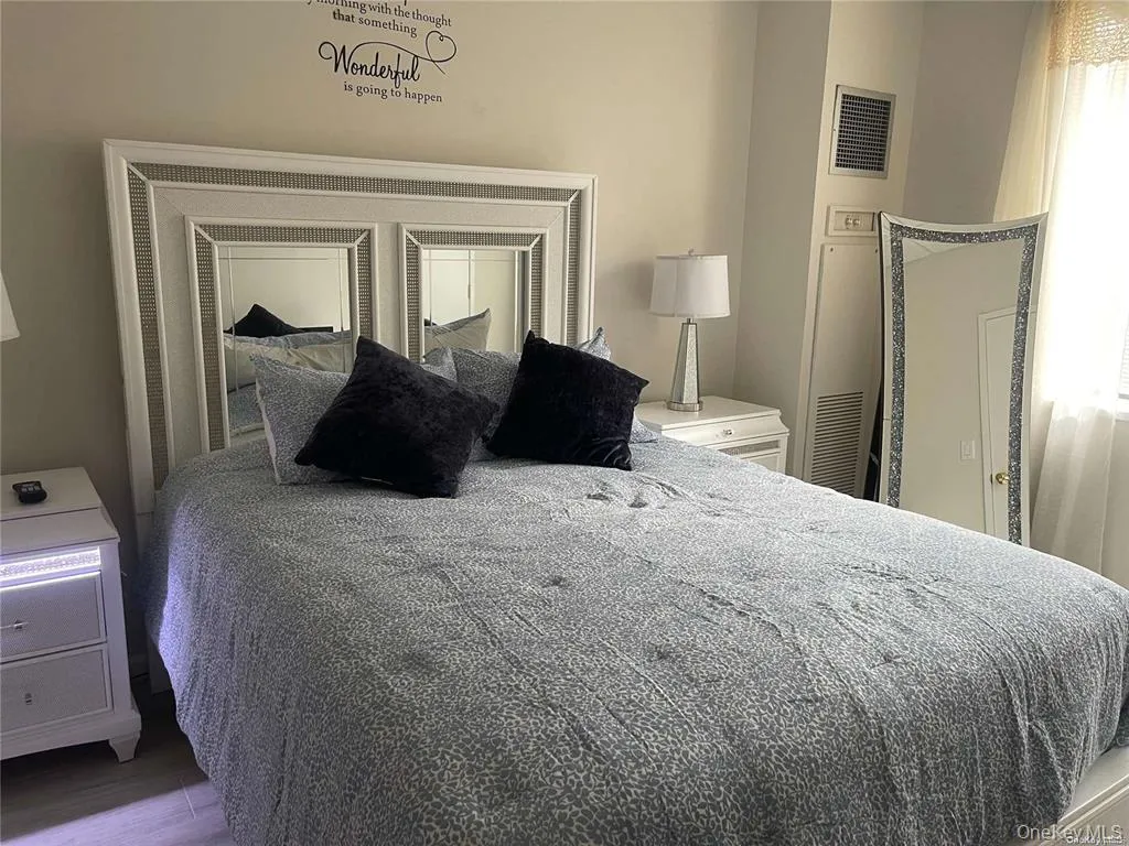 Bedroom featuring wood finished floors Bedroom featuring wood finished floors