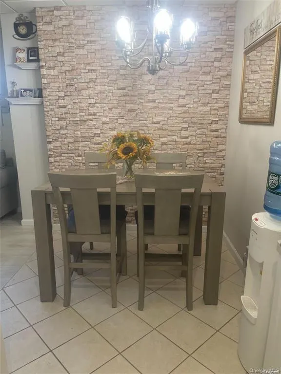 Dining area featuring light tile patterned floors Dining area featuring light tile patterned floors
