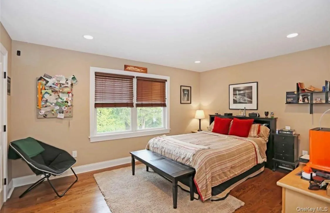 Bedroom with wood finished floors and recessed lighting Bedroom with wood finished floors and recessed lighting