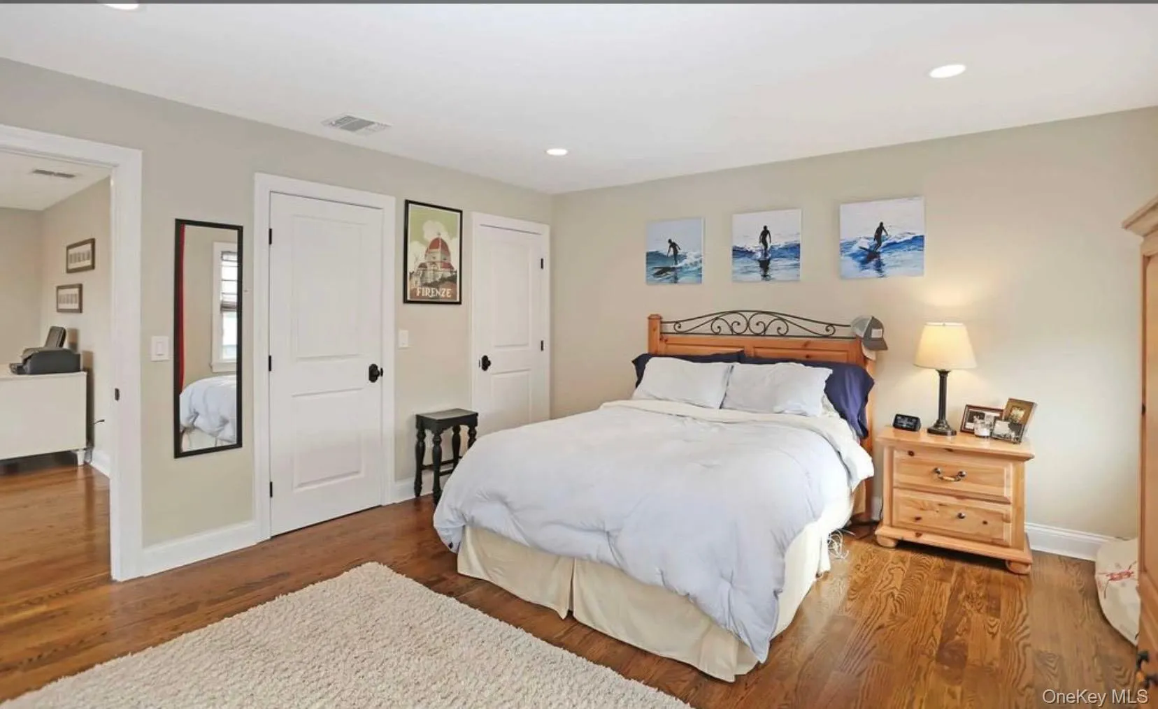Bedroom with wood finished floors, a closet, and recessed lighting Bedroom with wood finished floors, a closet, and recessed lighting