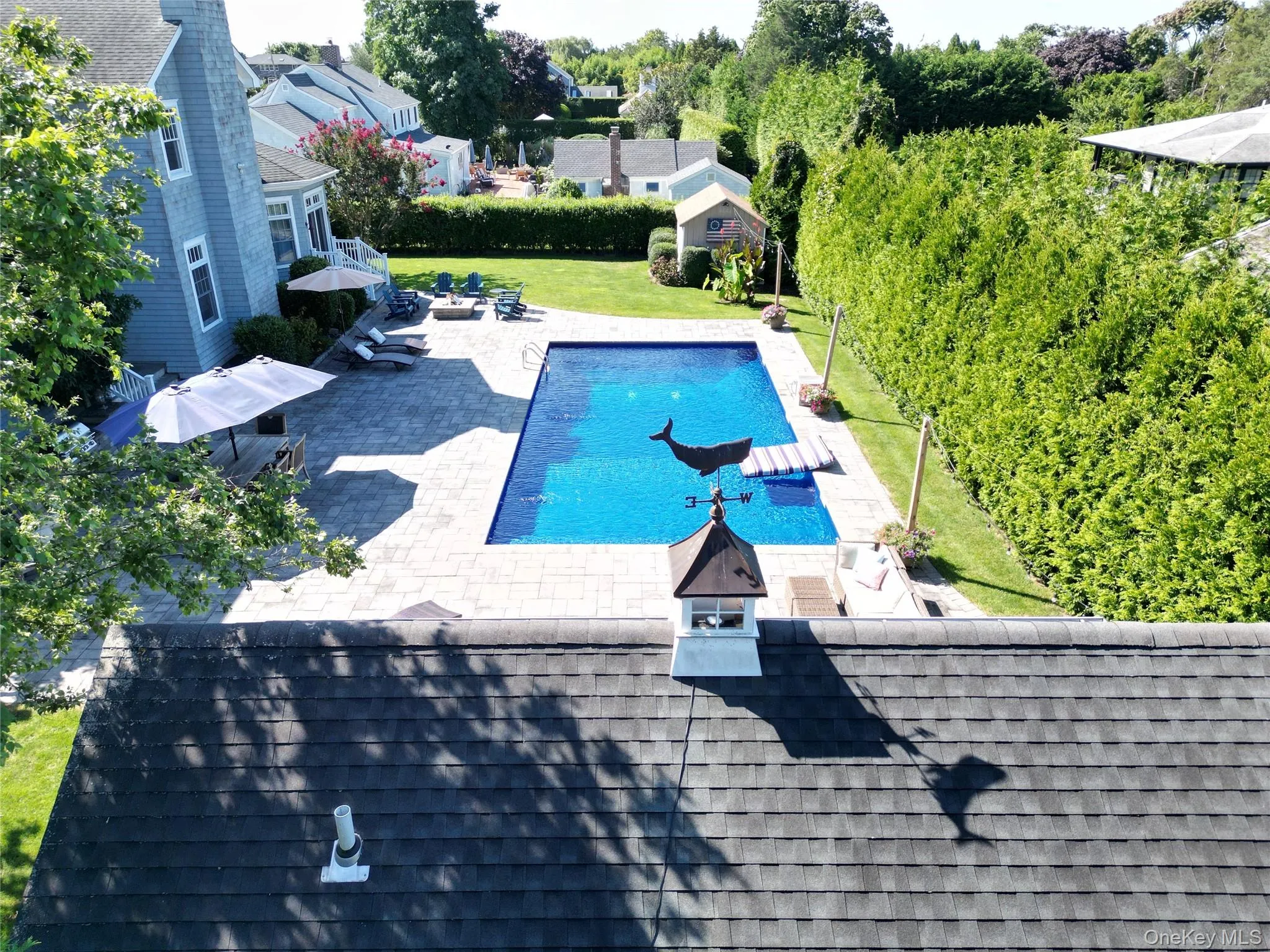View of pool with a patio and a lawn View of pool with a patio and a lawn