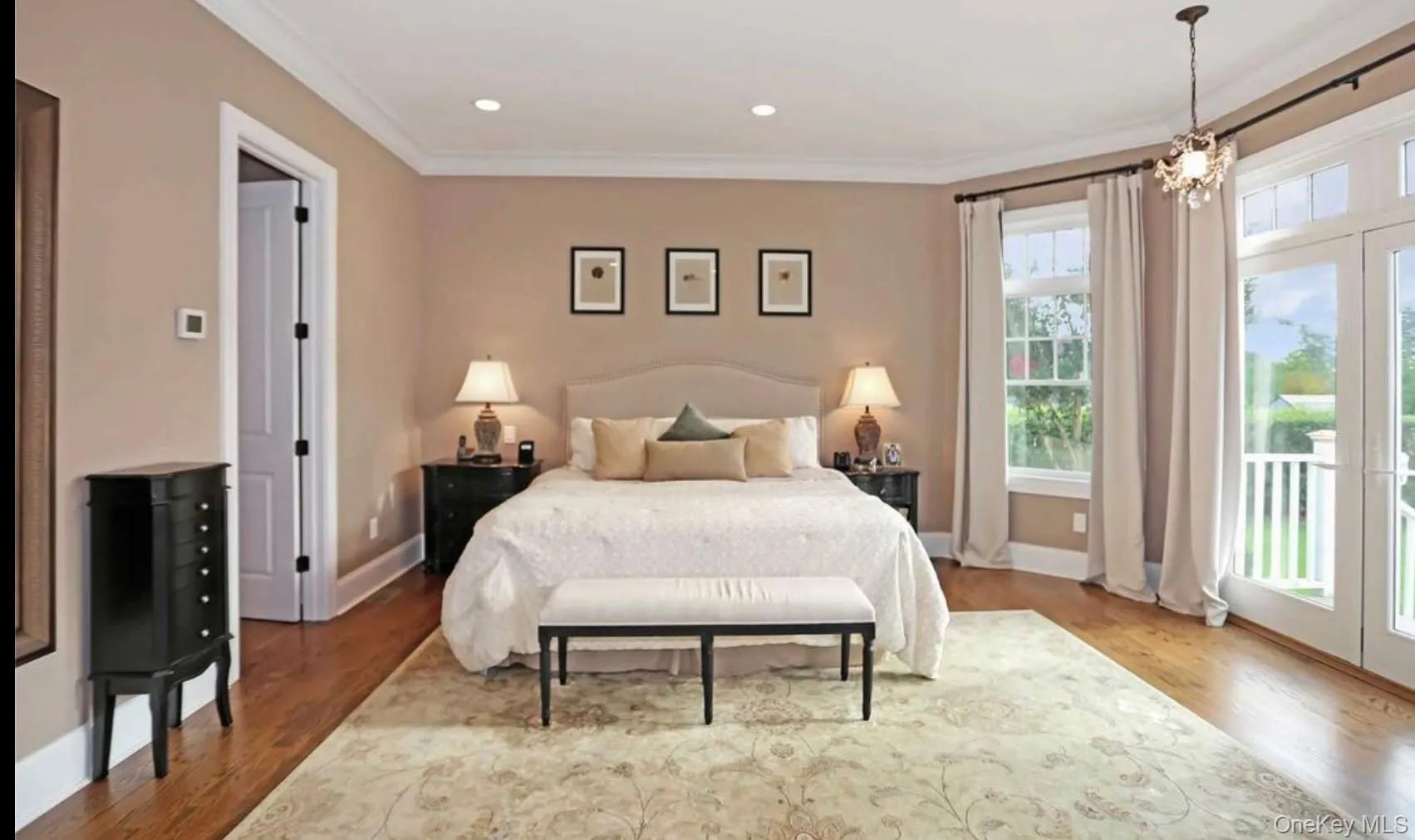 Bedroom with access to outside, ornamental molding, wood finished floors, recessed lighting, and a chandelier Bedroom with access to outside, ornamental molding, wood finished floors, recessed lighting, and a chandelier