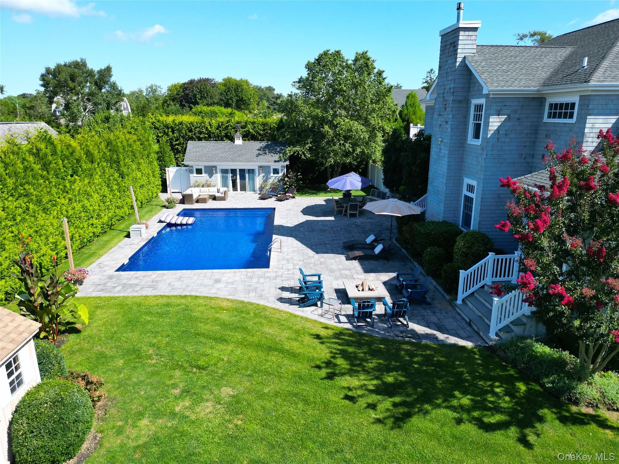 Outdoor pool with a patio area, an outbuilding, an exterior structure, an outdoor living space, and outdoor dining area Outdoor pool with a patio area, an outbuilding, an exterior structure, an outdoor living space, and outdoor dining area