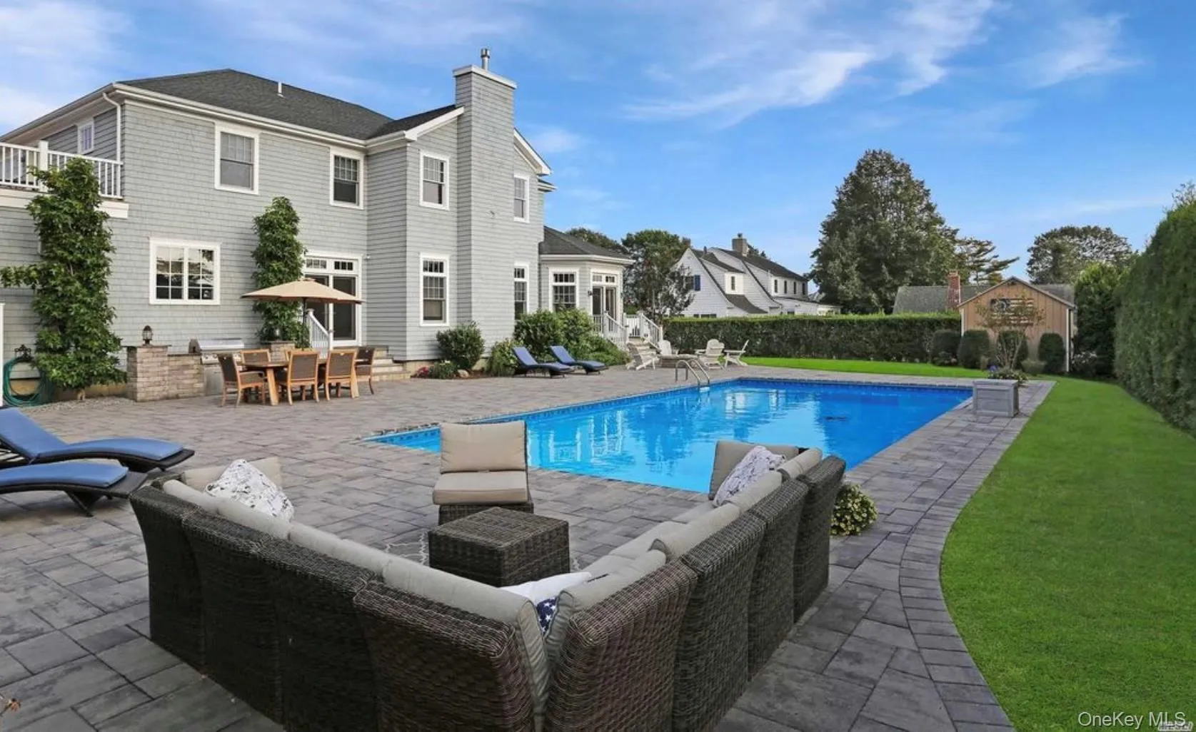 View of swimming pool featuring a patio area, an outdoor hangout area, a lawn, and entry steps View of swimming pool featuring a patio area, an outdoor hangout area, a lawn, and entry steps