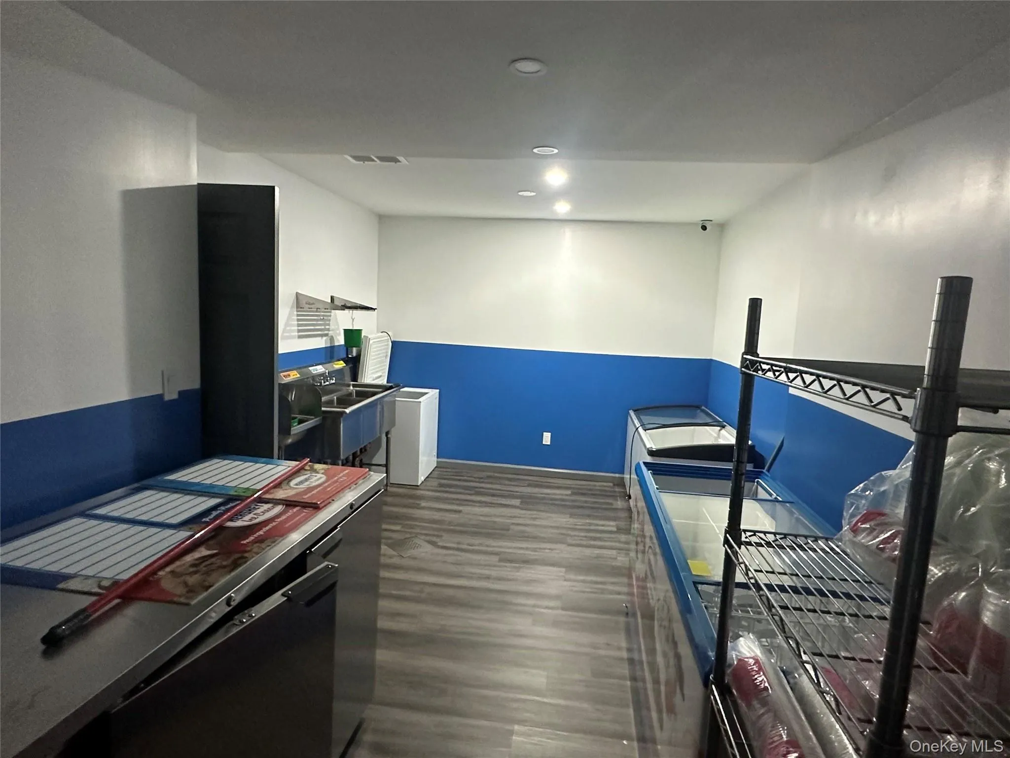 Kitchen with recessed lighting and dark wood finished floors Kitchen with recessed lighting and dark wood finished floors