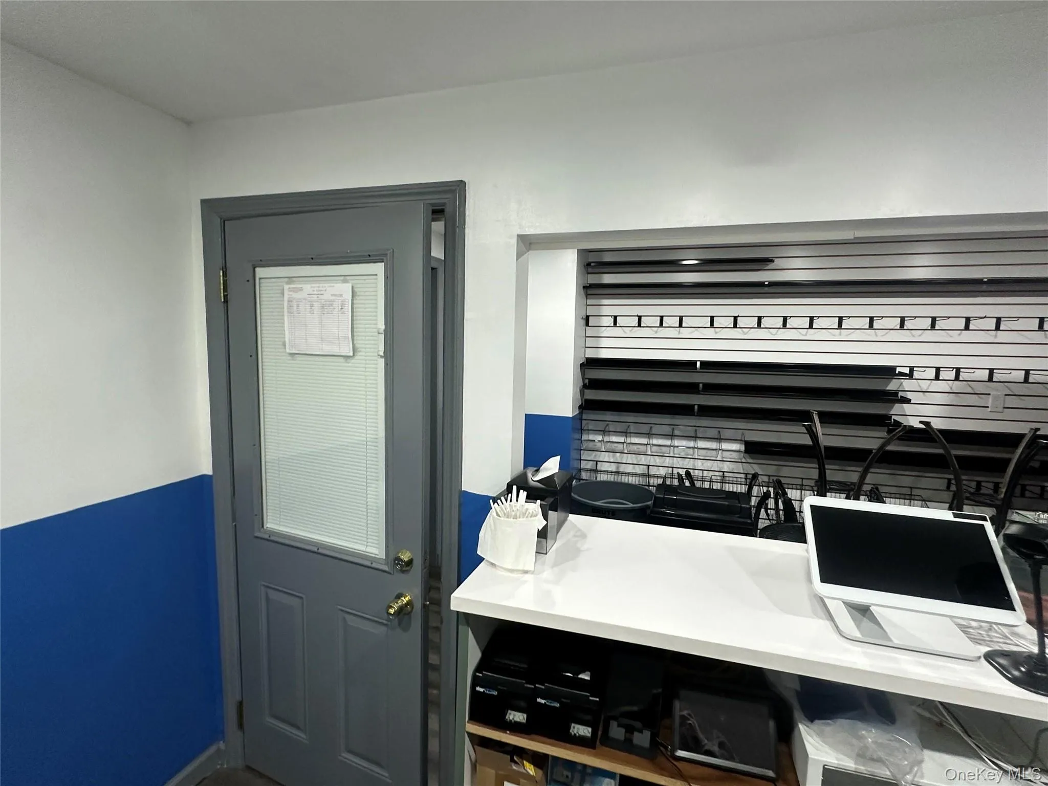 Doorway to outside featuring baseboards Doorway to outside featuring baseboards