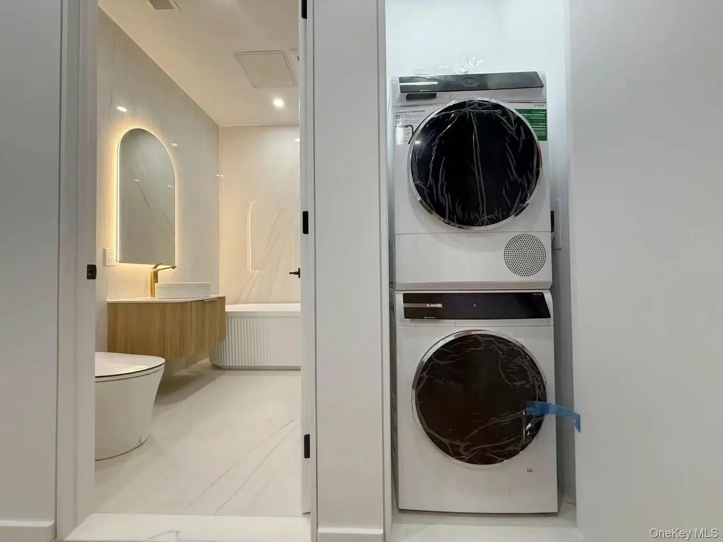 Laundry area with estacked washer and dryer Laundry area with estacked washer and dryer