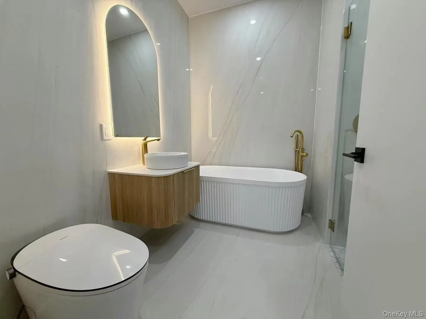 Full bathroom with vanity and a freestanding tub Full bathroom with vanity and a freestanding tub