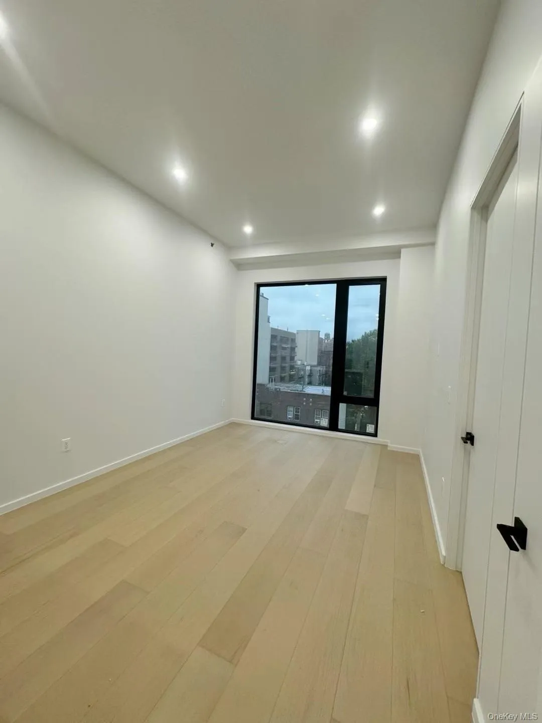 Unfurnished room with light wood-type flooring and recessed lighting Unfurnished room with light wood-type flooring and recessed lighting