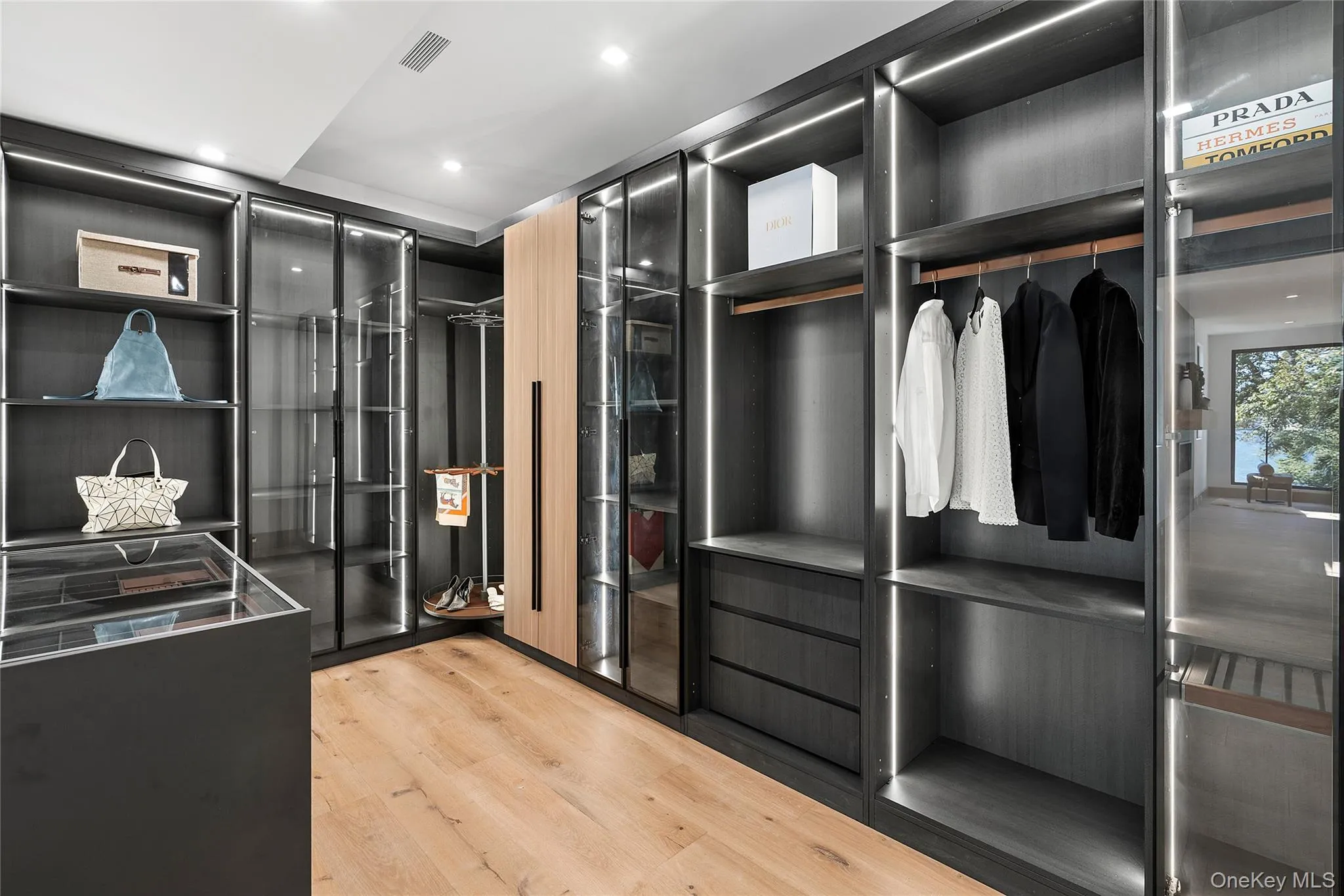 Spacious closet featuring light wood-style floors