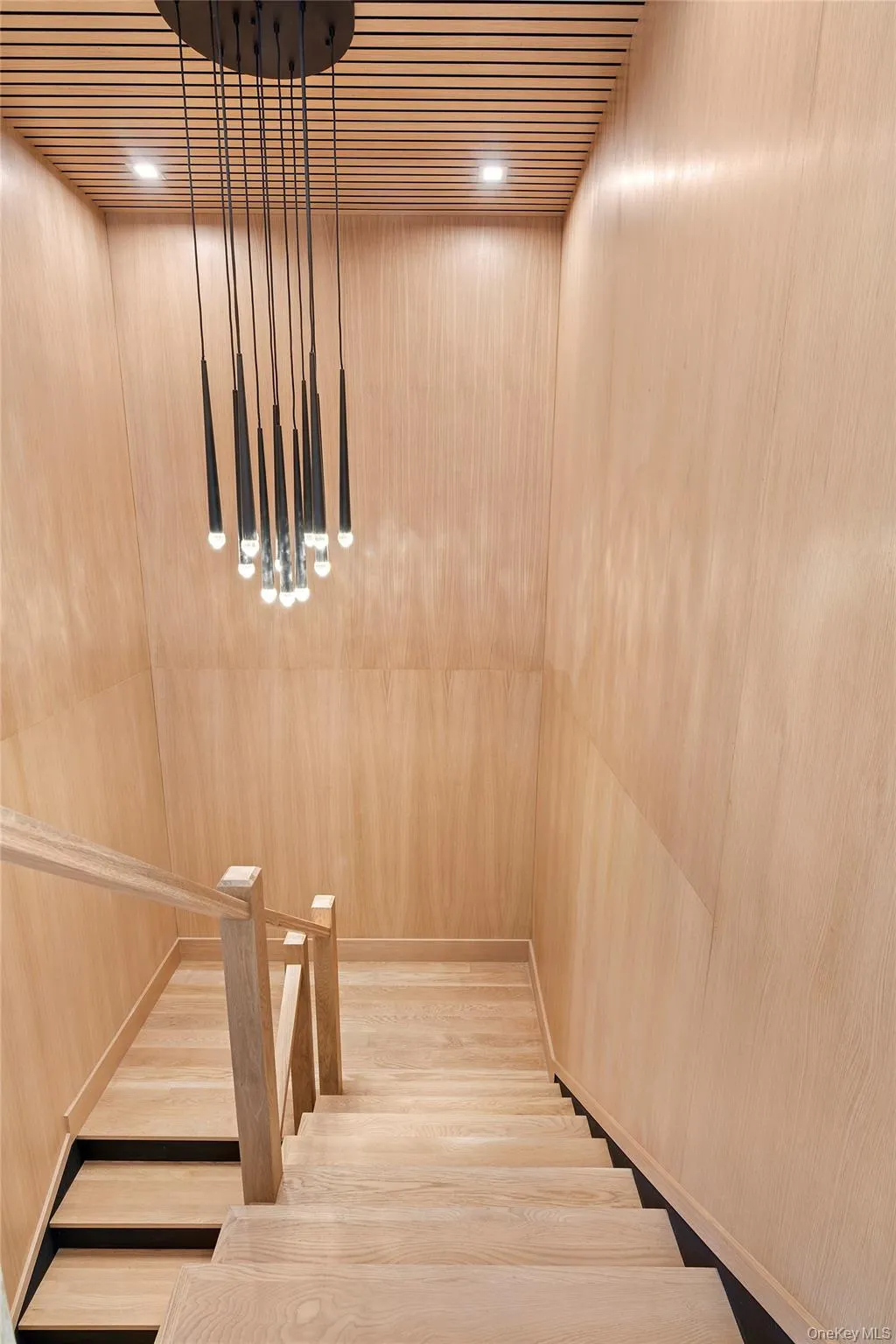 Stairway with elevator and wood finished floors Stairway with elevator and wood finished floors