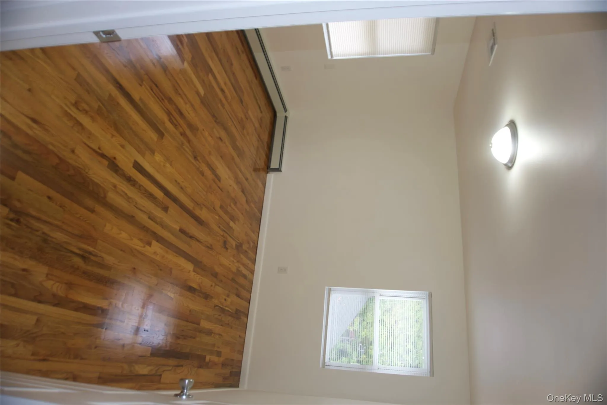 Unfurnished room with dark wood-style floors Unfurnished room with dark wood-style floors