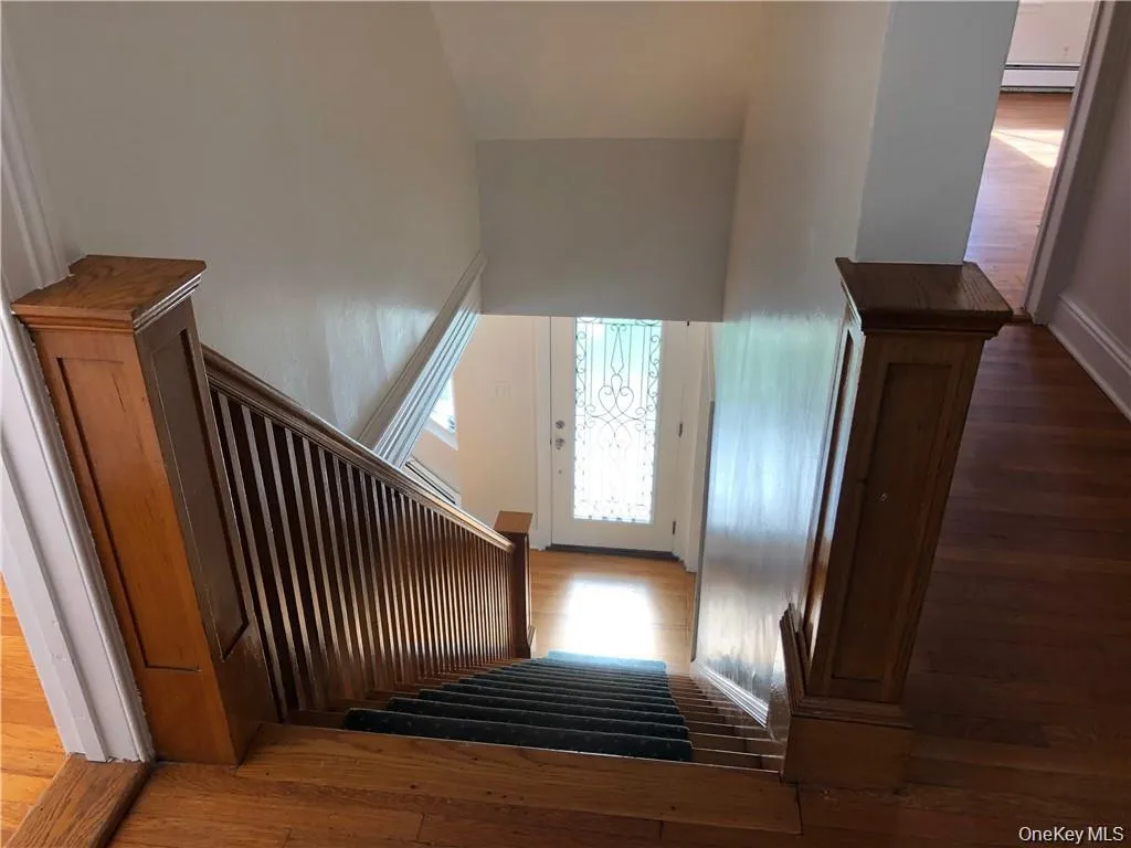 Stairs with hardwood / wood-style floors and baseboards Stairs with hardwood / wood-style floors and baseboards