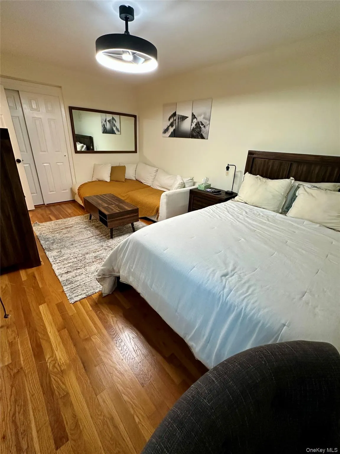 Bedroom featuring wood finished floors and a ceiling fan Bedroom featuring wood finished floors and a ceiling fan