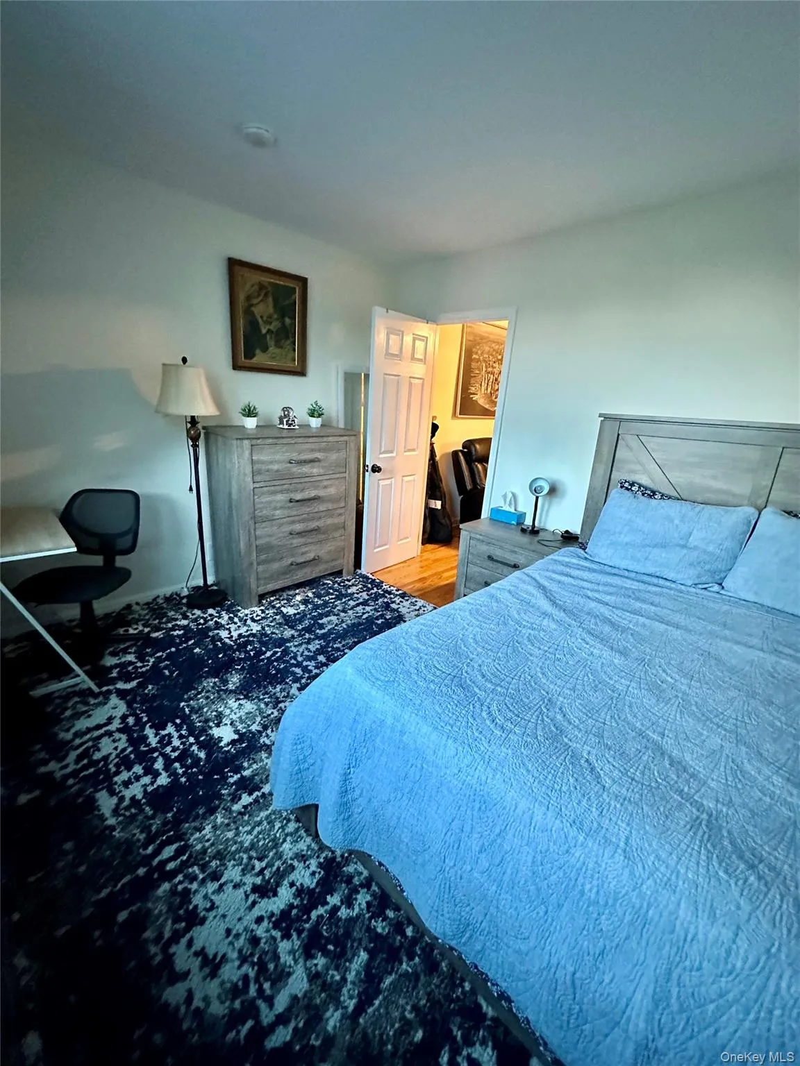 Bedroom featuring wood finished floors Bedroom featuring wood finished floors