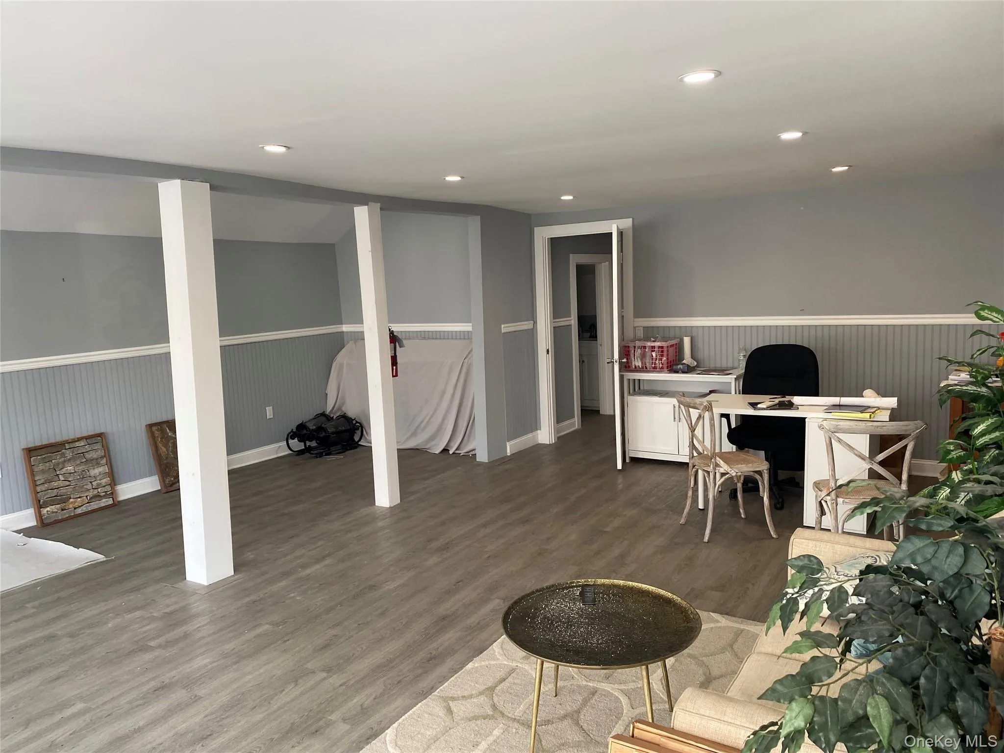 Office space with recessed lighting and wainscoting Office space with recessed lighting and wainscoting