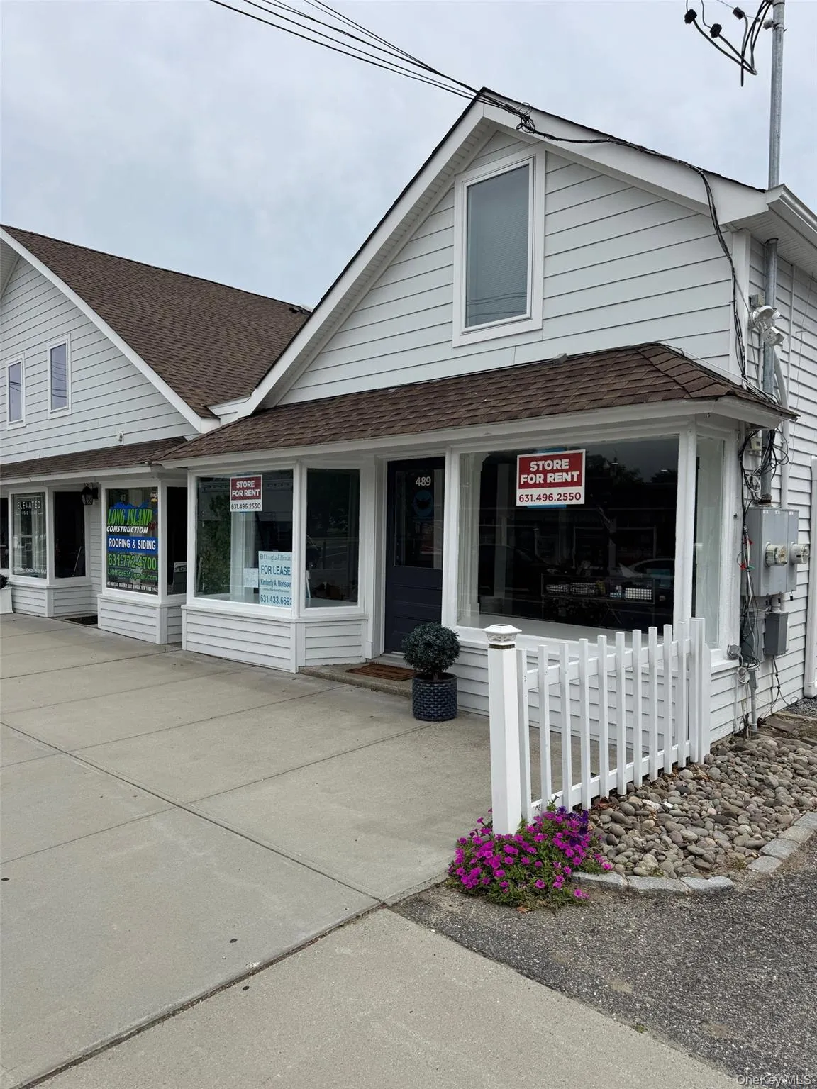 View of front facade with a shingled roof View of front facade with a shingled roof