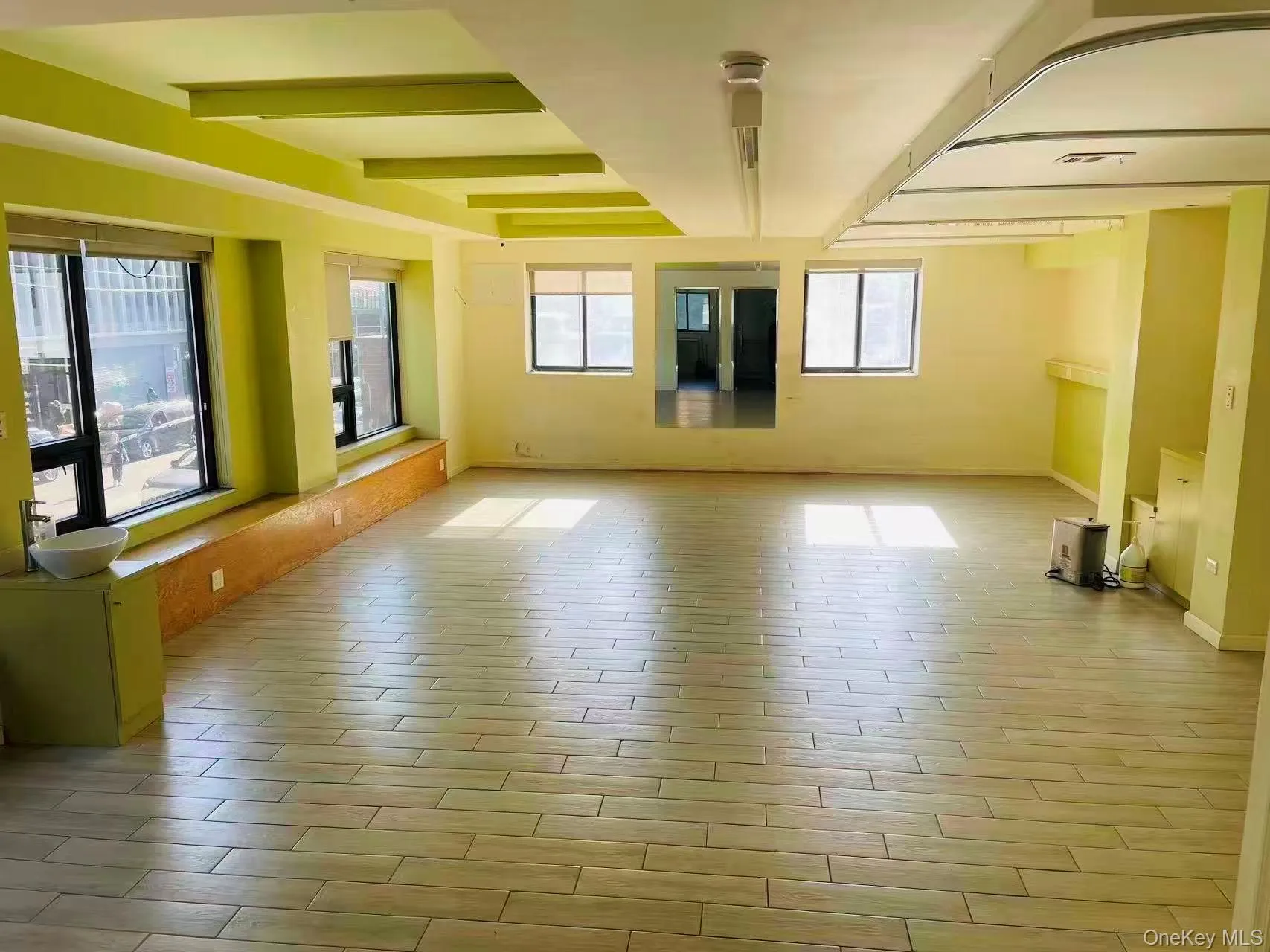 Spare room with wood finished floors and baseboards Spare room with wood finished floors and baseboards