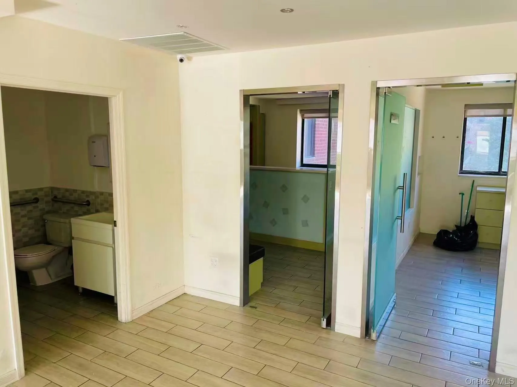 Hallway featuring wood finish floors Hallway featuring wood finish floors