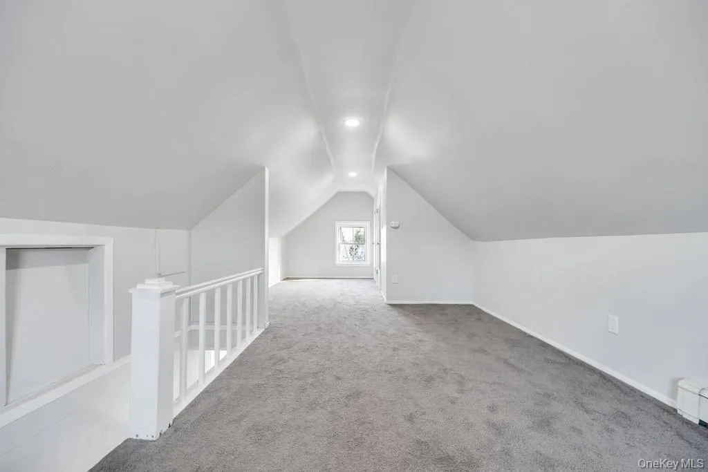Bonus room featuring carpet floors and lofted ceiling Bonus room featuring carpet floors and lofted ceiling