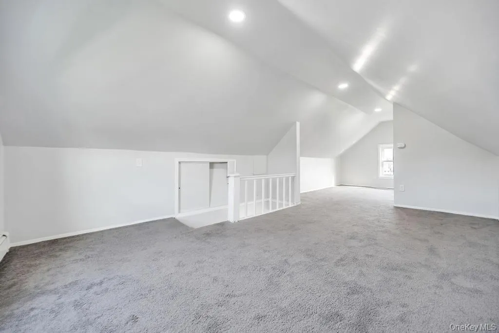 Bonus room with vaulted ceiling, carpet, and recessed lighting Bonus room with vaulted ceiling, carpet, and recessed lighting