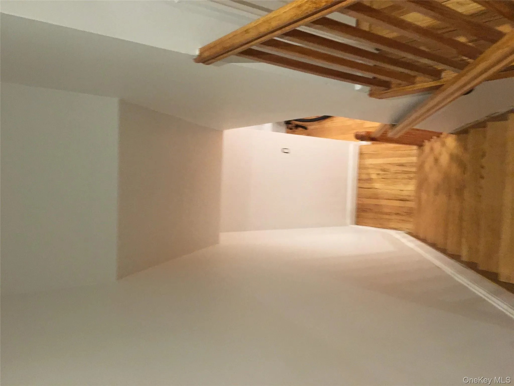 Stairway featuring wood finished floors and baseboards Stairway featuring wood finished floors and baseboards