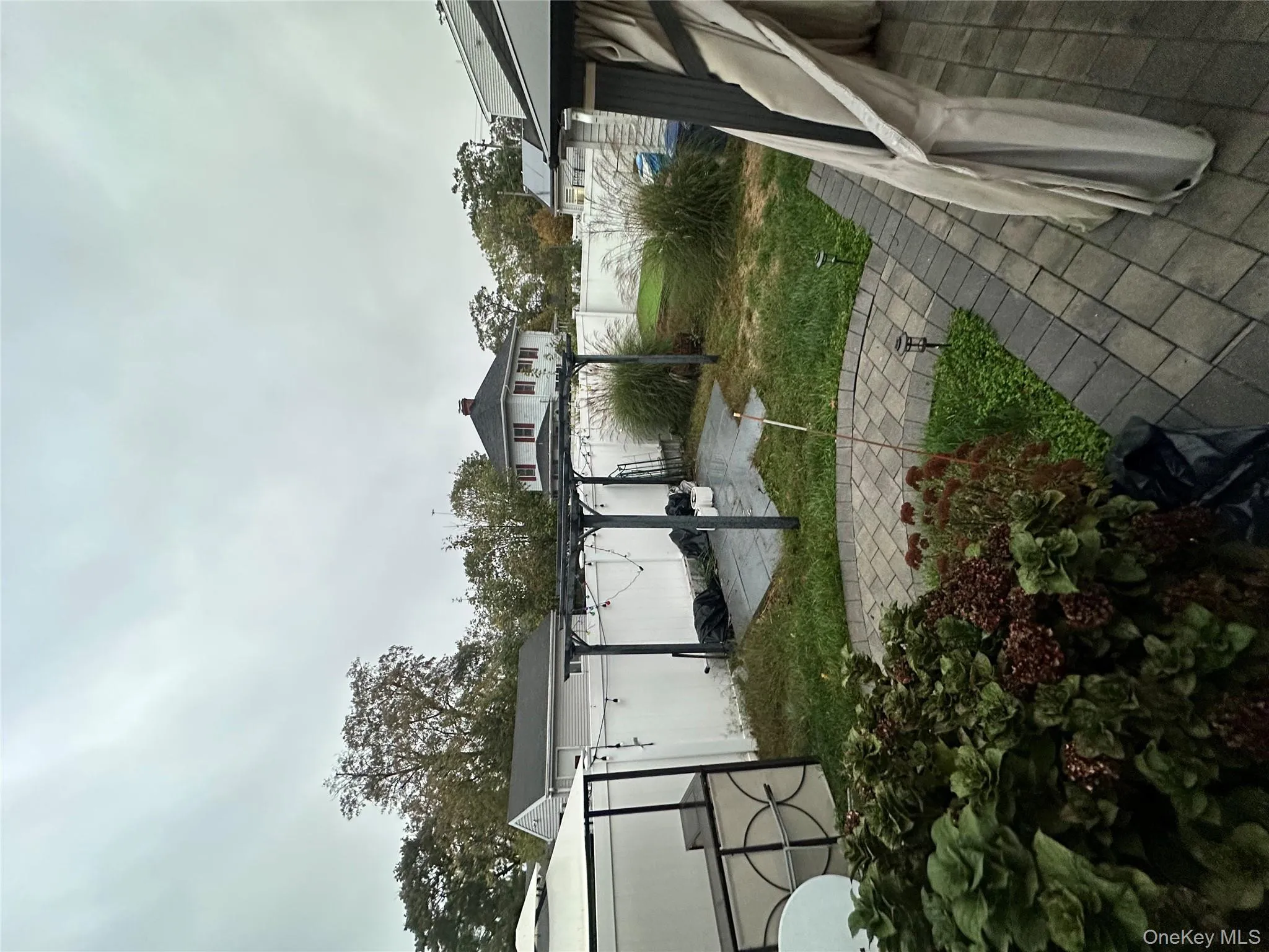 Fenced backyard with a patio and a pergola Fenced backyard with a patio and a pergola