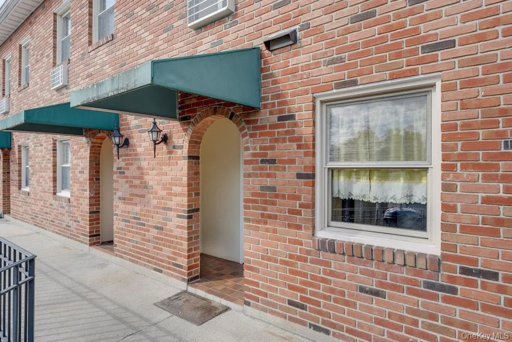 Entrance to property featuring brick siding Entrance to property featuring brick siding