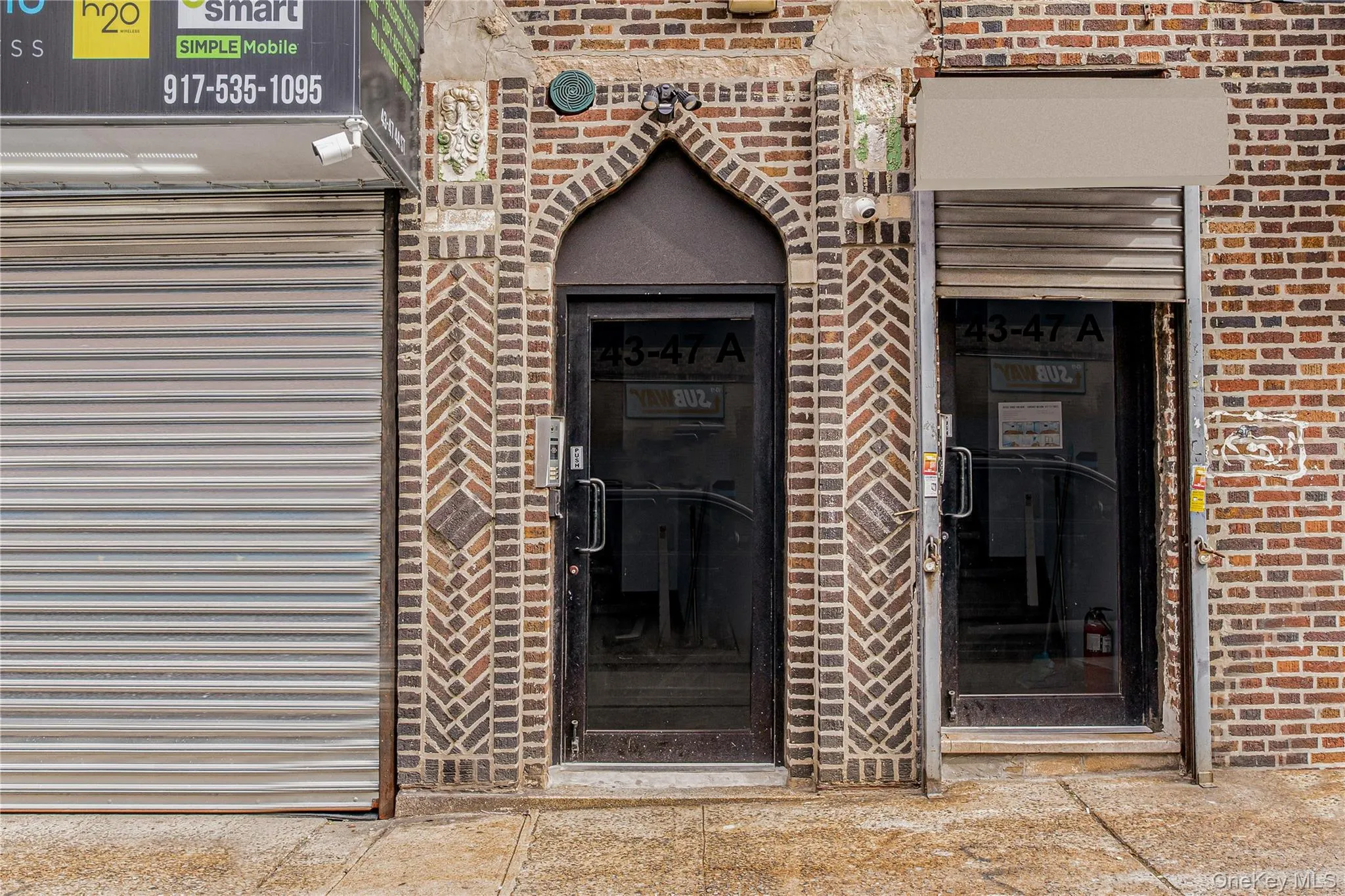 Doorway to property with brick siding Doorway to property with brick siding