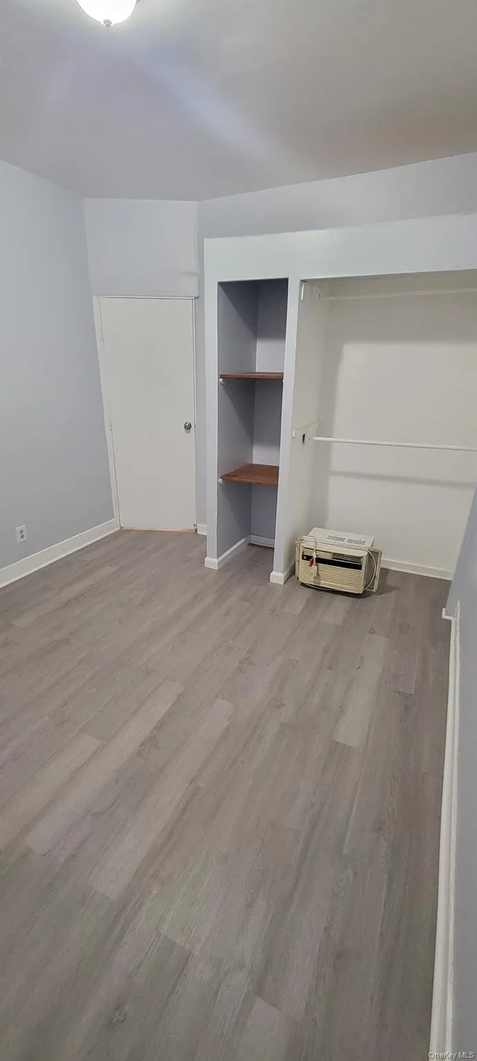 Unfurnished bedroom with light wood-style flooring Unfurnished bedroom with light wood-style flooring