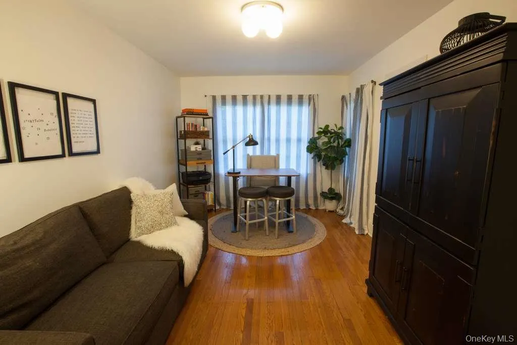 Sitting room featuring light wood-style floors Sitting room featuring light wood-style floors