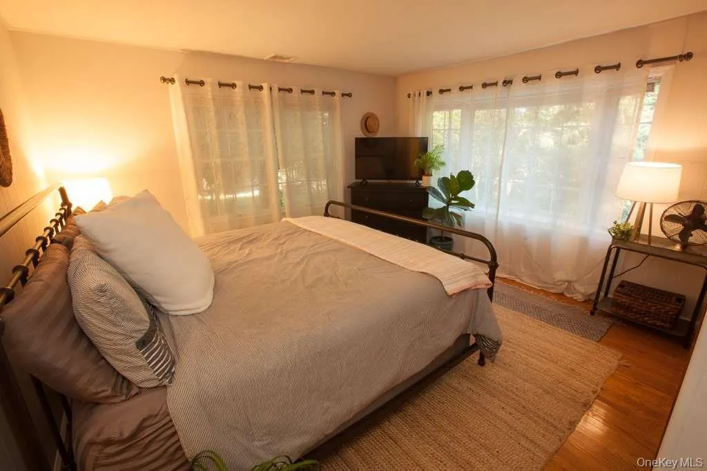 Bedroom with wood finished floors Bedroom with wood finished floors
