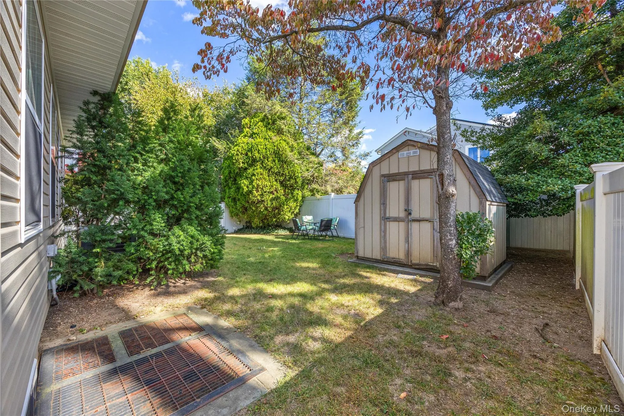 Fenced backyard with a shed Fenced backyard with a shed
