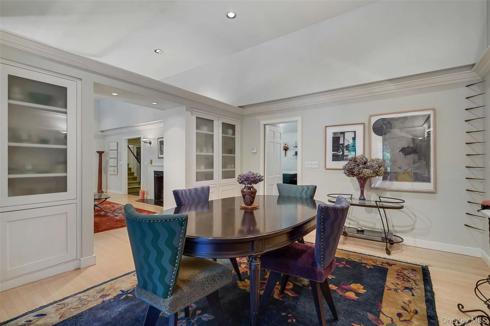 Dining room featuring recessed lighting, light wood-style flooring, crown molding, and baseboards Dining room featuring recessed lighting, light wood-style flooring, crown molding, and baseboards