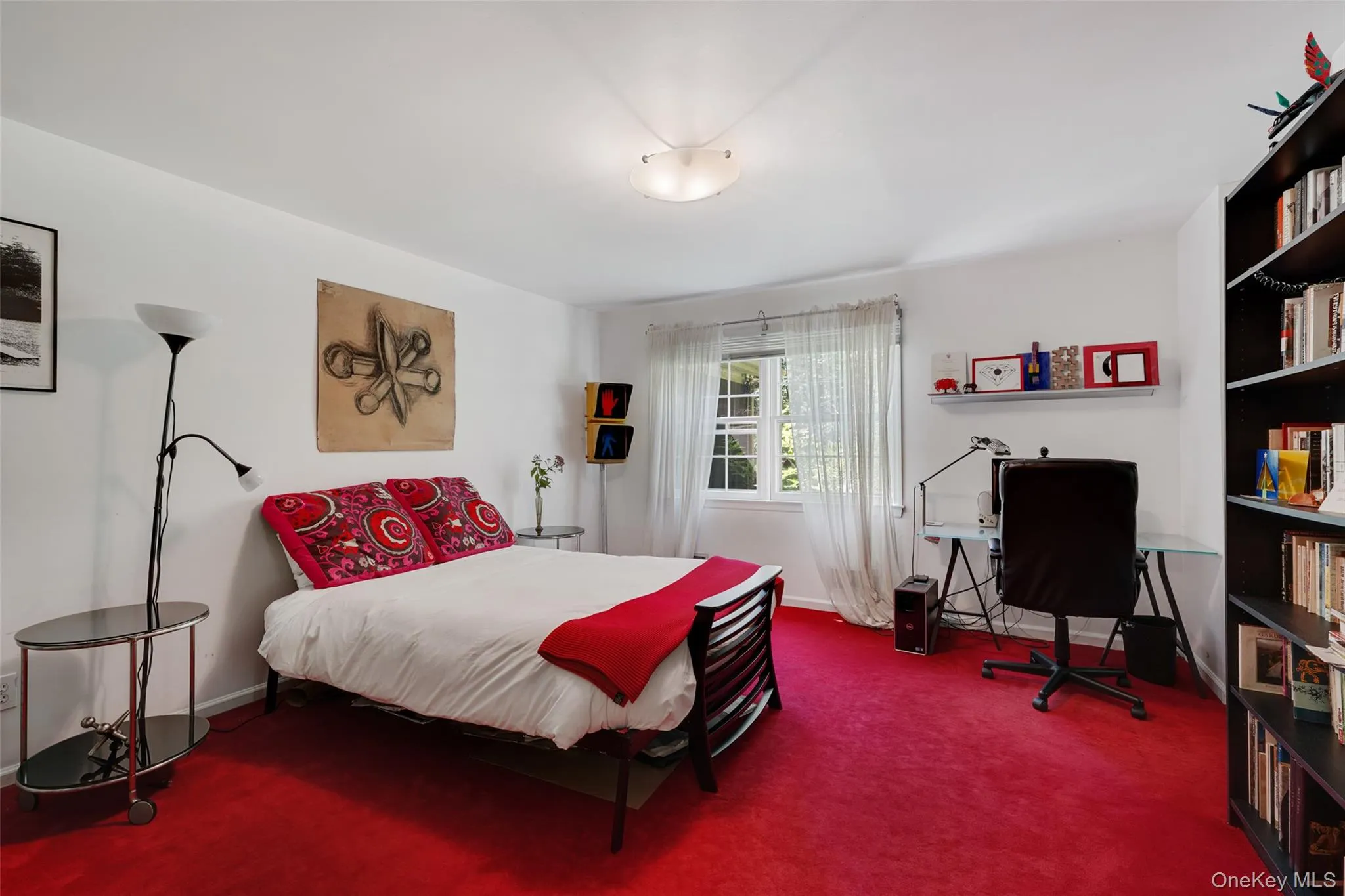 Carpeted bedroom featuring baseboards Carpeted bedroom featuring baseboards