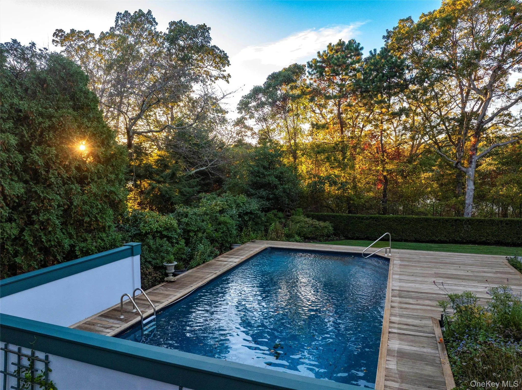 Outdoor pool featuring a wooden deck Outdoor pool featuring a wooden deck