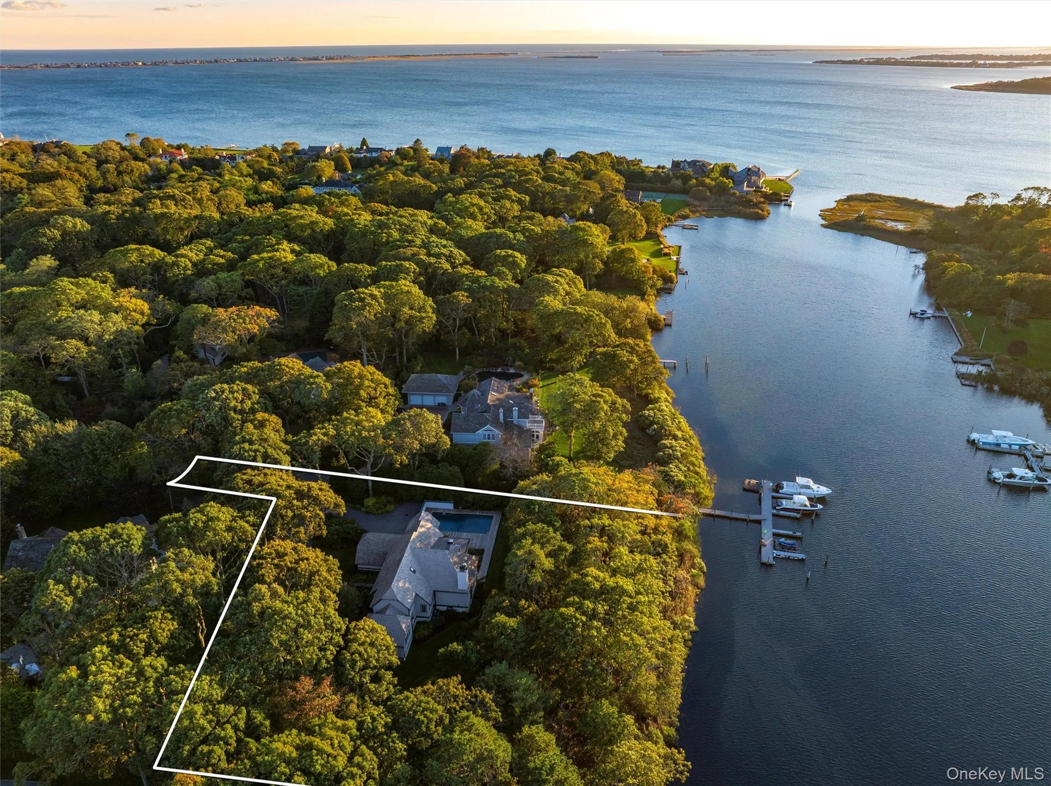 Aerial view at dusk of a water view and property parcel outlined Aerial view at dusk of a water view and property parcel outlined