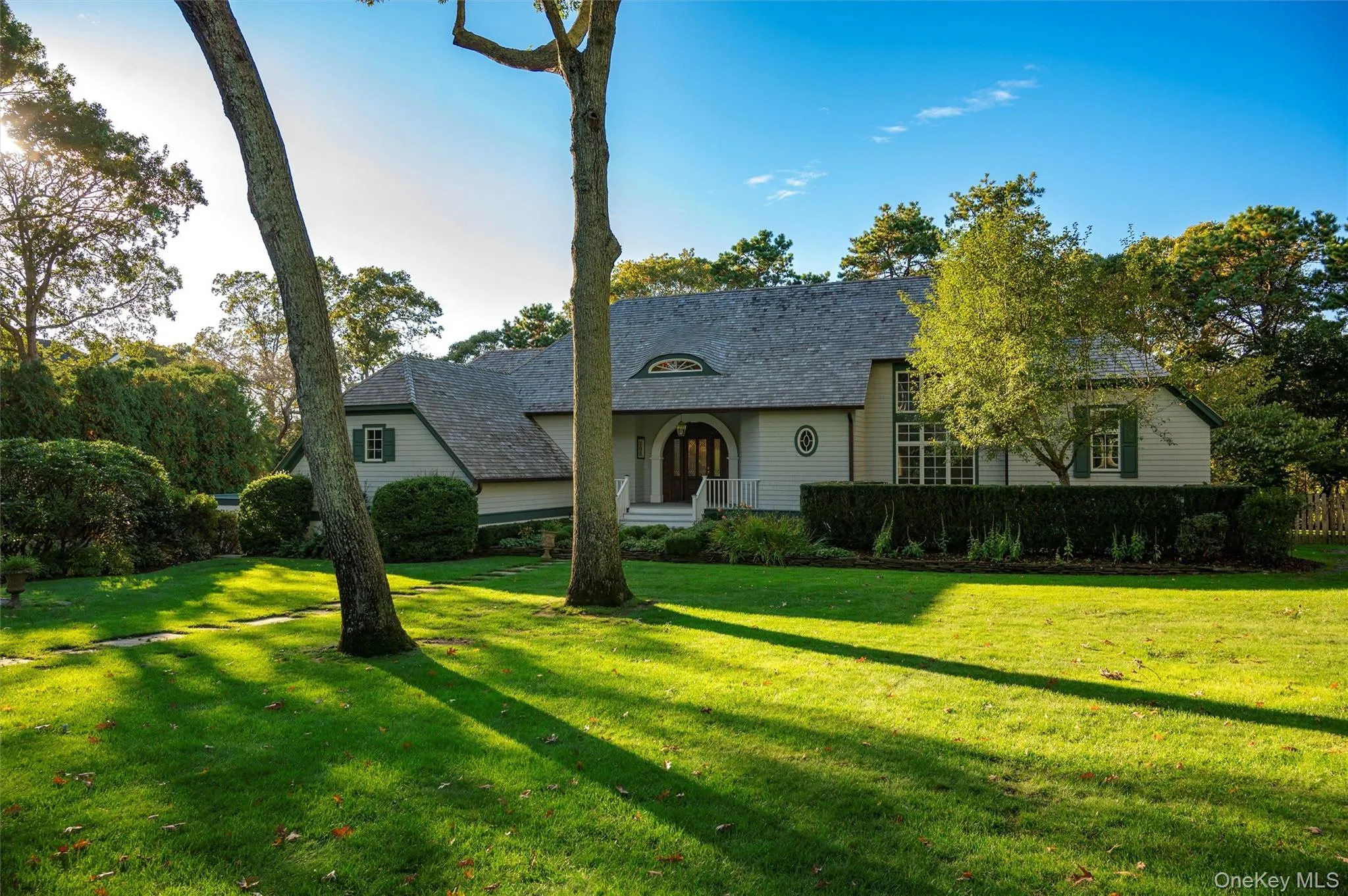 View of front of property with a front lawn and covered porch View of front of property with a front lawn and covered porch