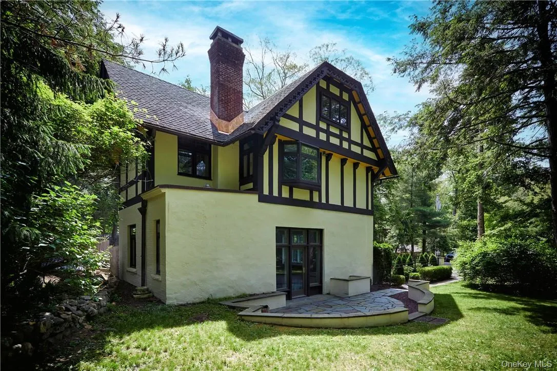 Back of property featuring french doors and a lawn Back of property featuring french doors and a lawn