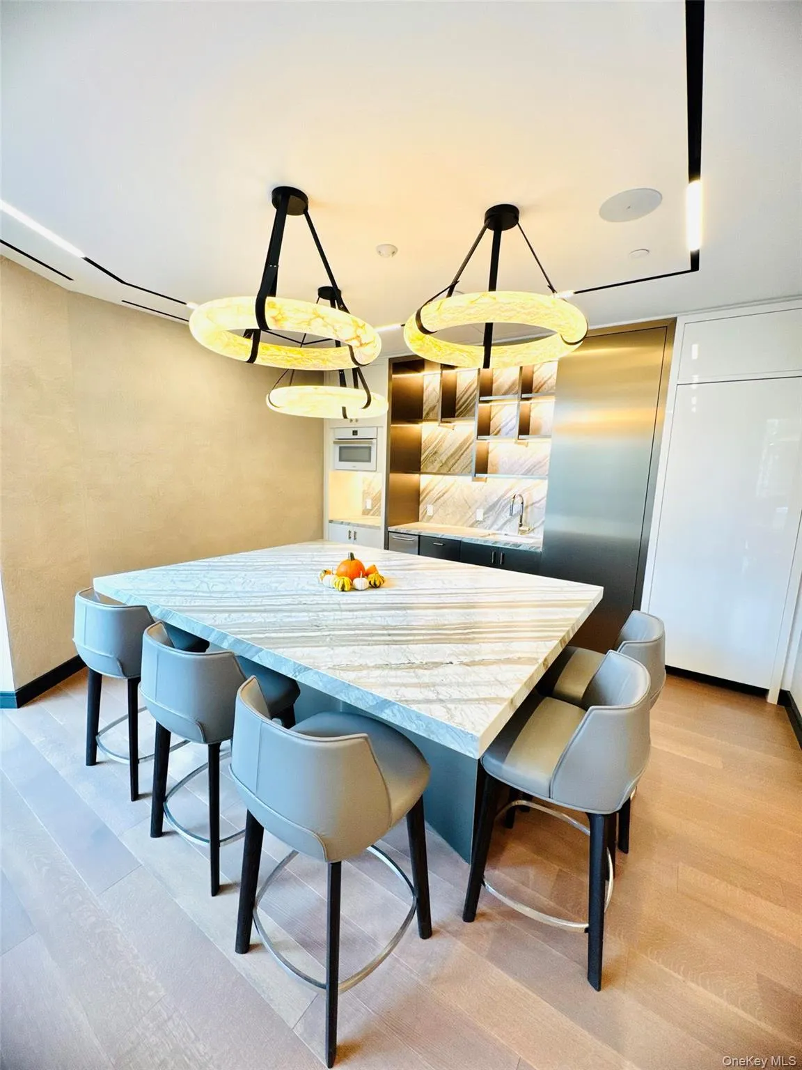 Dining area with light wood finished floors Dining area with light wood finished floors