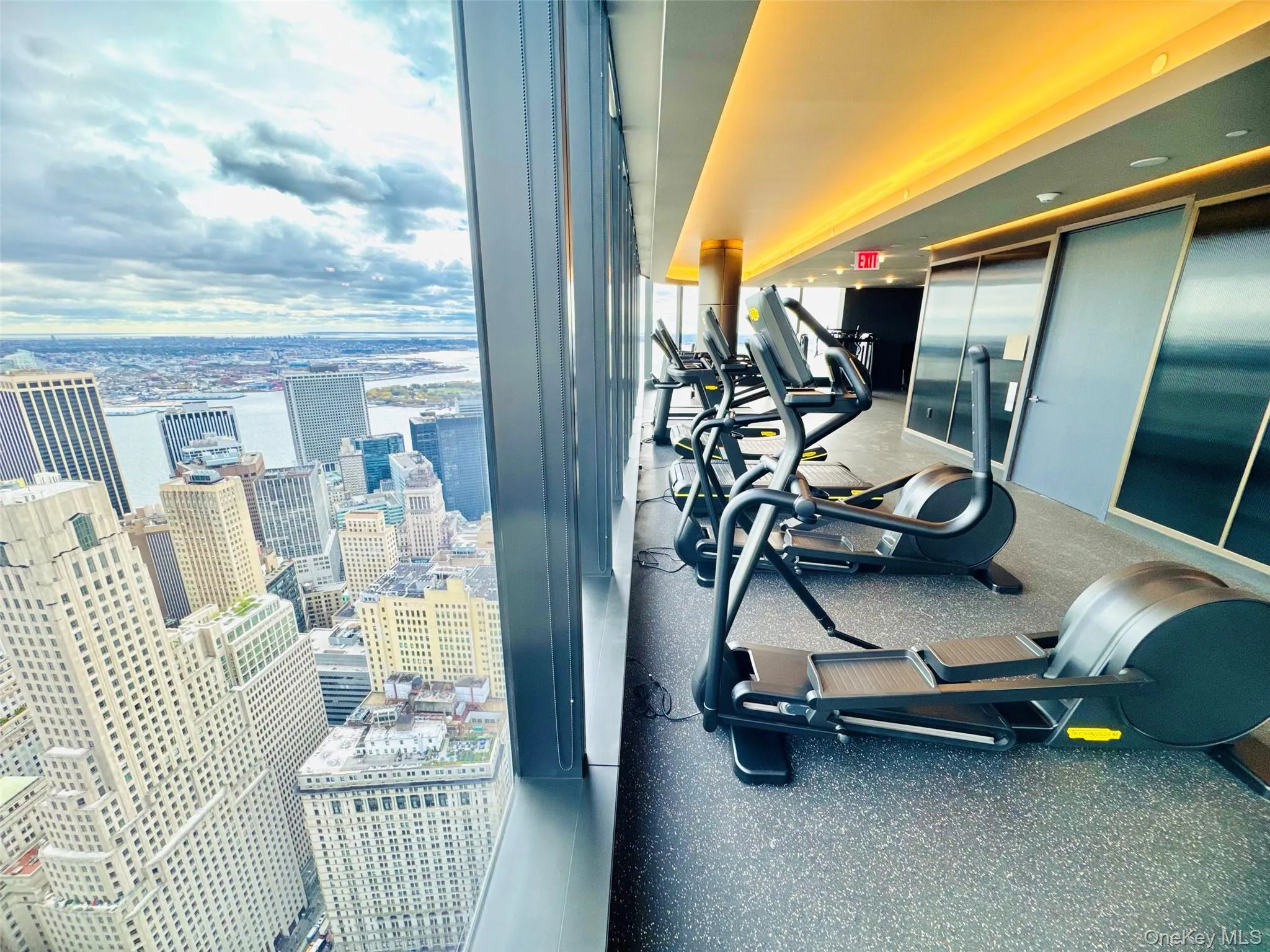 Exercise room featuring a view of city Exercise room featuring a view of city