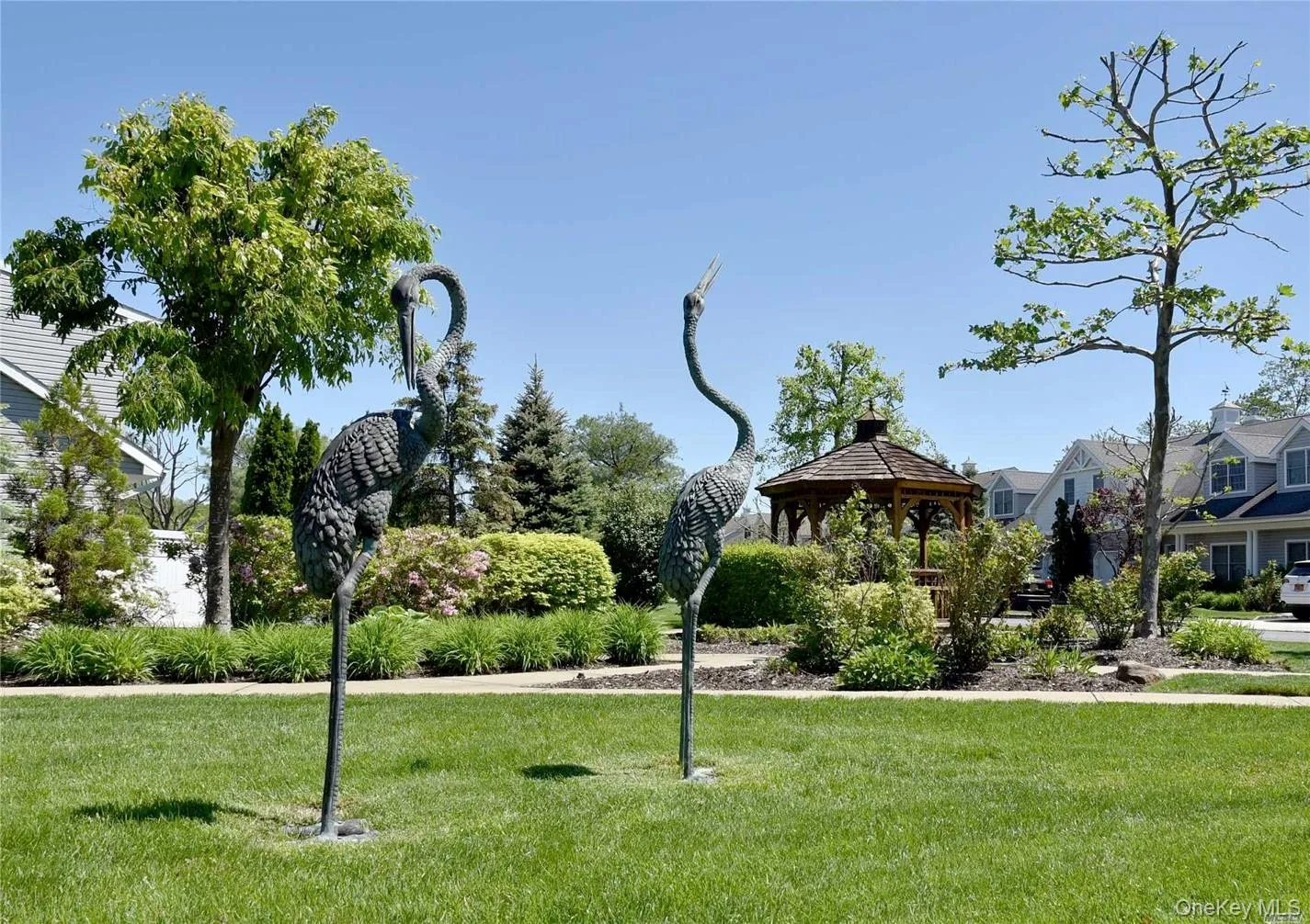 View of property's community featuring a lawn and a gazebo View of property's community featuring a lawn and a gazebo