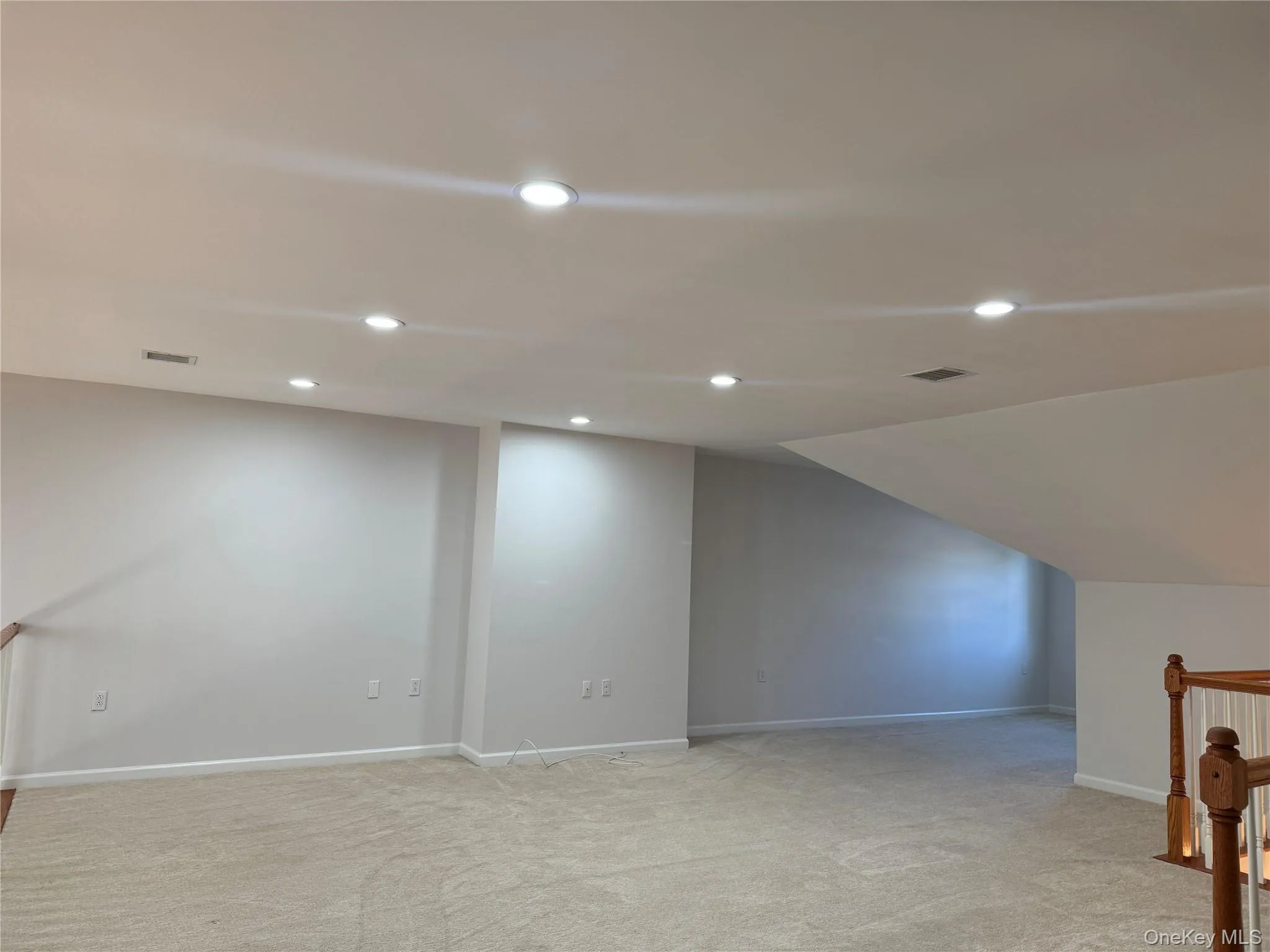 Additional living space featuring recessed lighting and light colored carpet Additional living space featuring recessed lighting and light colored carpet