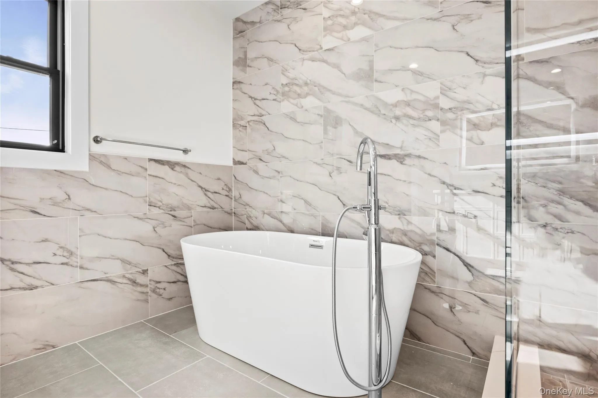 Full bathroom featuring a soaking tub Full bathroom featuring a soaking tub