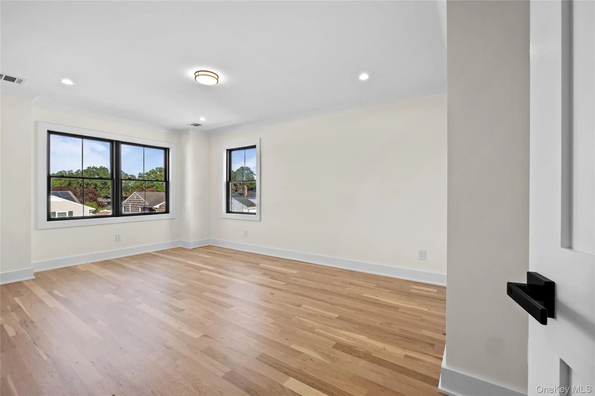 Spare room with light wood-style flooring and recessed lighting Spare room with light wood-style flooring and recessed lighting