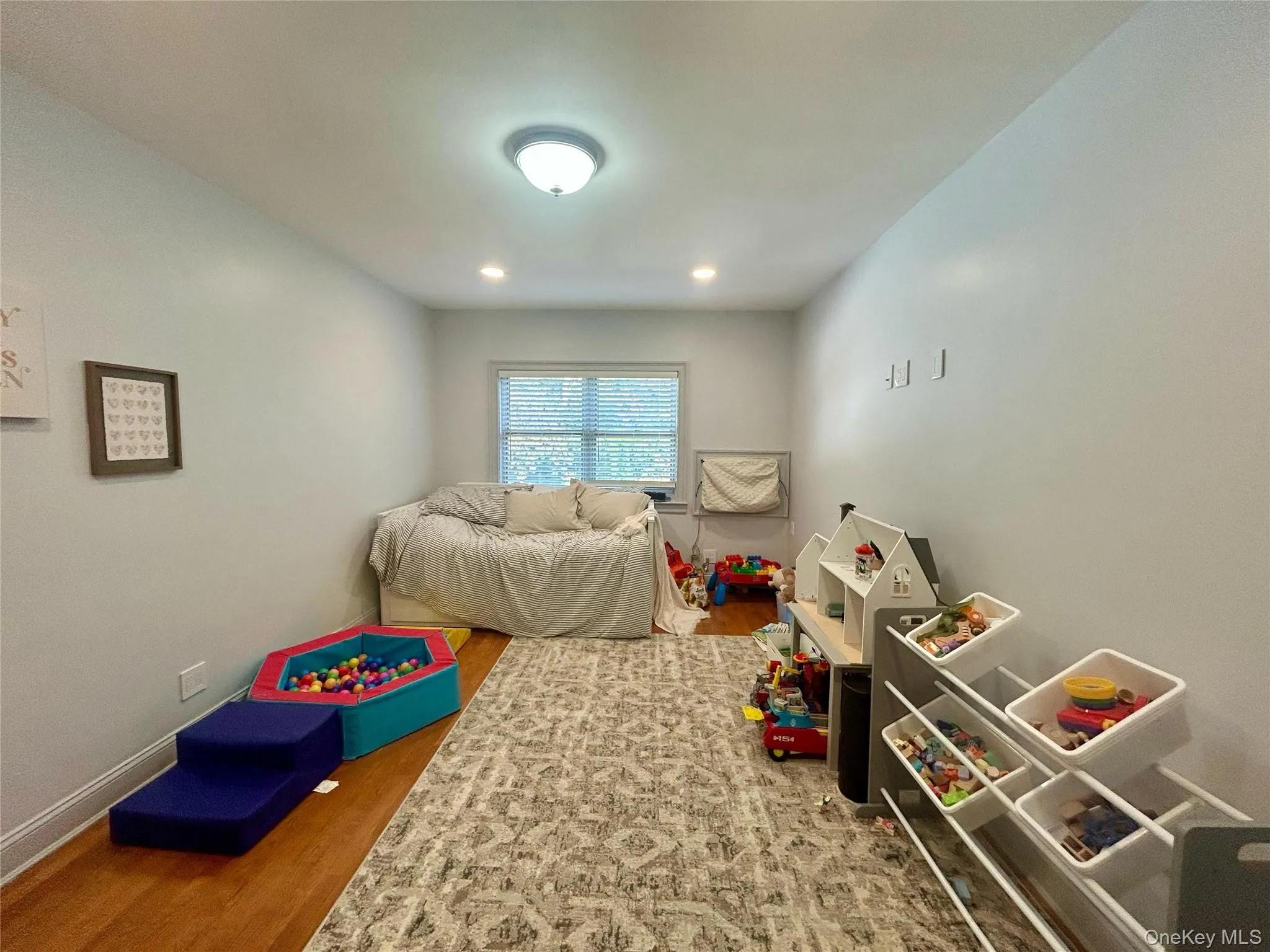 Playroom featuring wood finished floors and recessed lighting Playroom featuring wood finished floors and recessed lighting