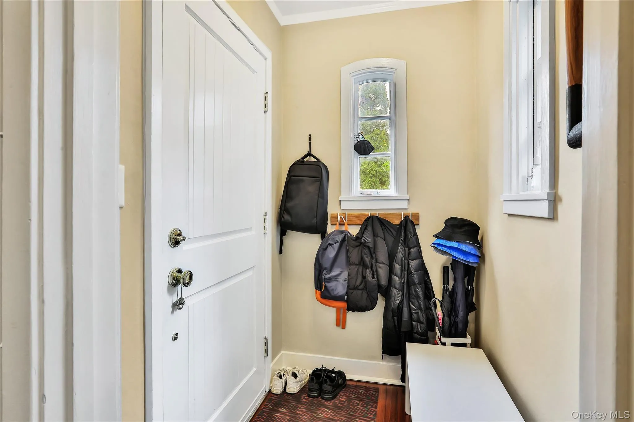 Entryway featuring ornamental molding Entryway featuring ornamental molding