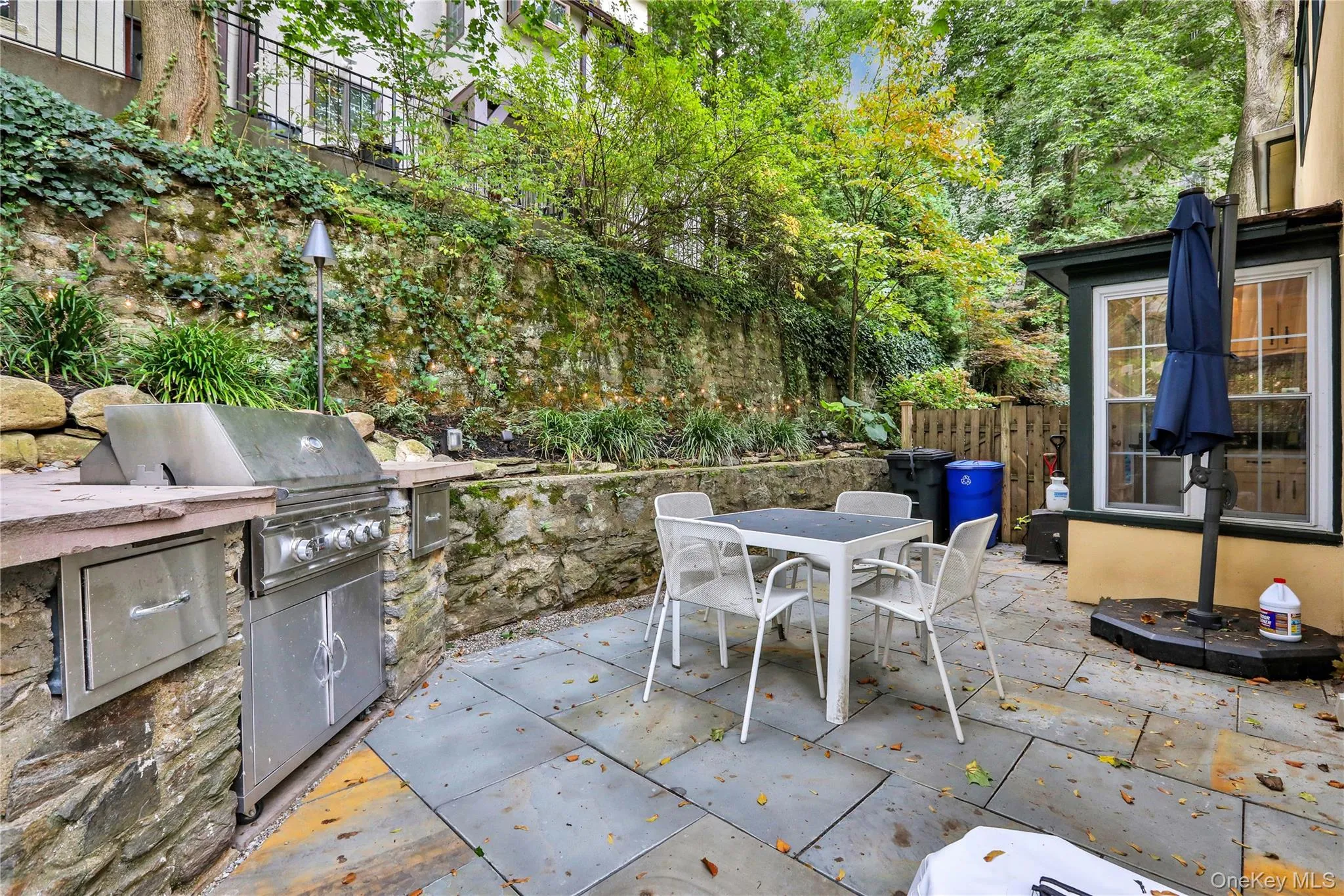 View of patio featuring outdoor dining space and area for grilling View of patio featuring outdoor dining space and area for grilling