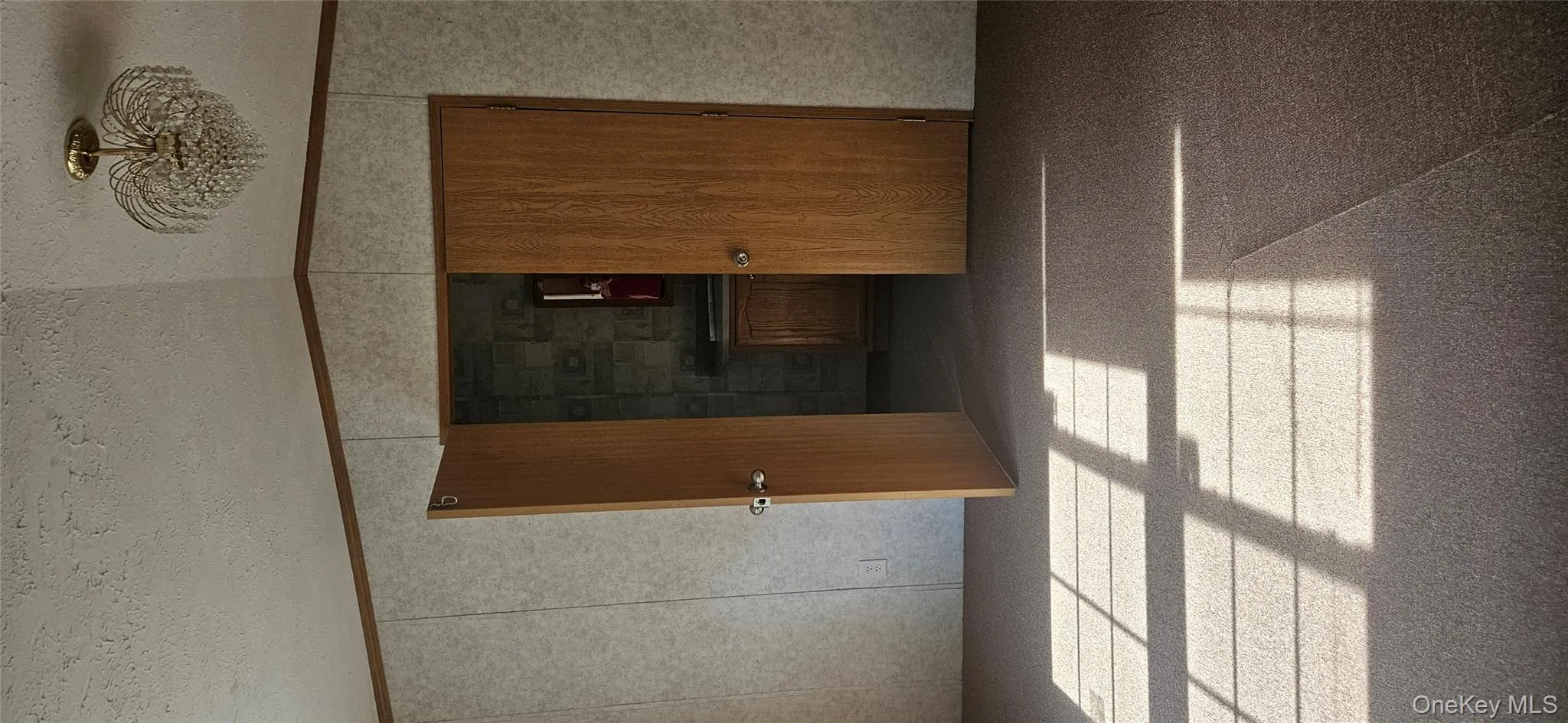 Unfurnished room featuring a textured ceiling and crown molding Unfurnished room featuring a textured ceiling and crown molding